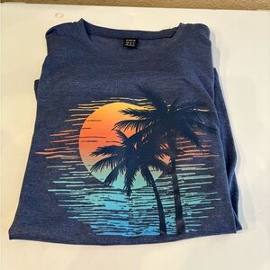 Blue T-Shirt with Sunset and Palm Tree Design